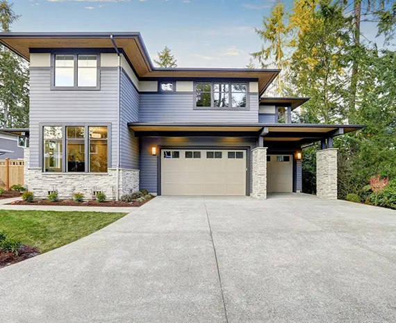 Contemporary two-story home with a double garage and driveway.